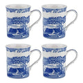 Set of four blue and white ceramic mugs with landscape motif and curved handles
