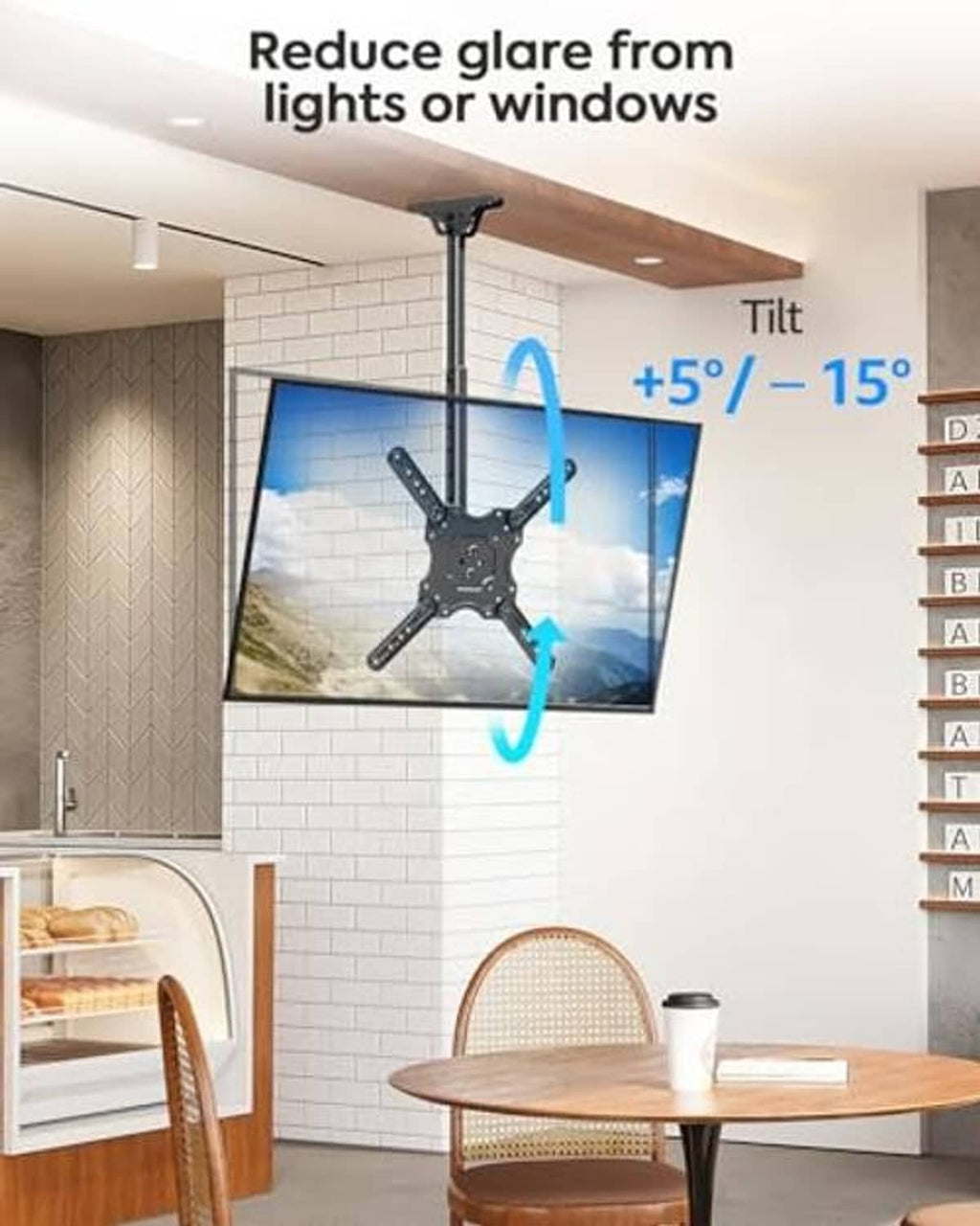 Black ceiling TV mount with tilt-adjustable arm holding a flat TV panel