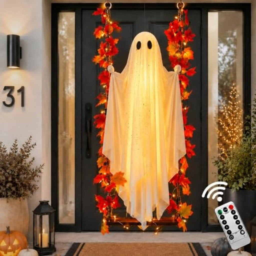 Hanging ghost decoration with warm white LED glow, red orange leaf garland, and hanging hooks