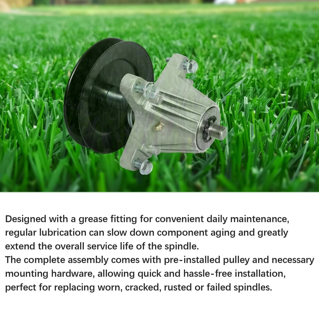 Mower deck spindle assembly with black pulley wheel and silver housing on grass