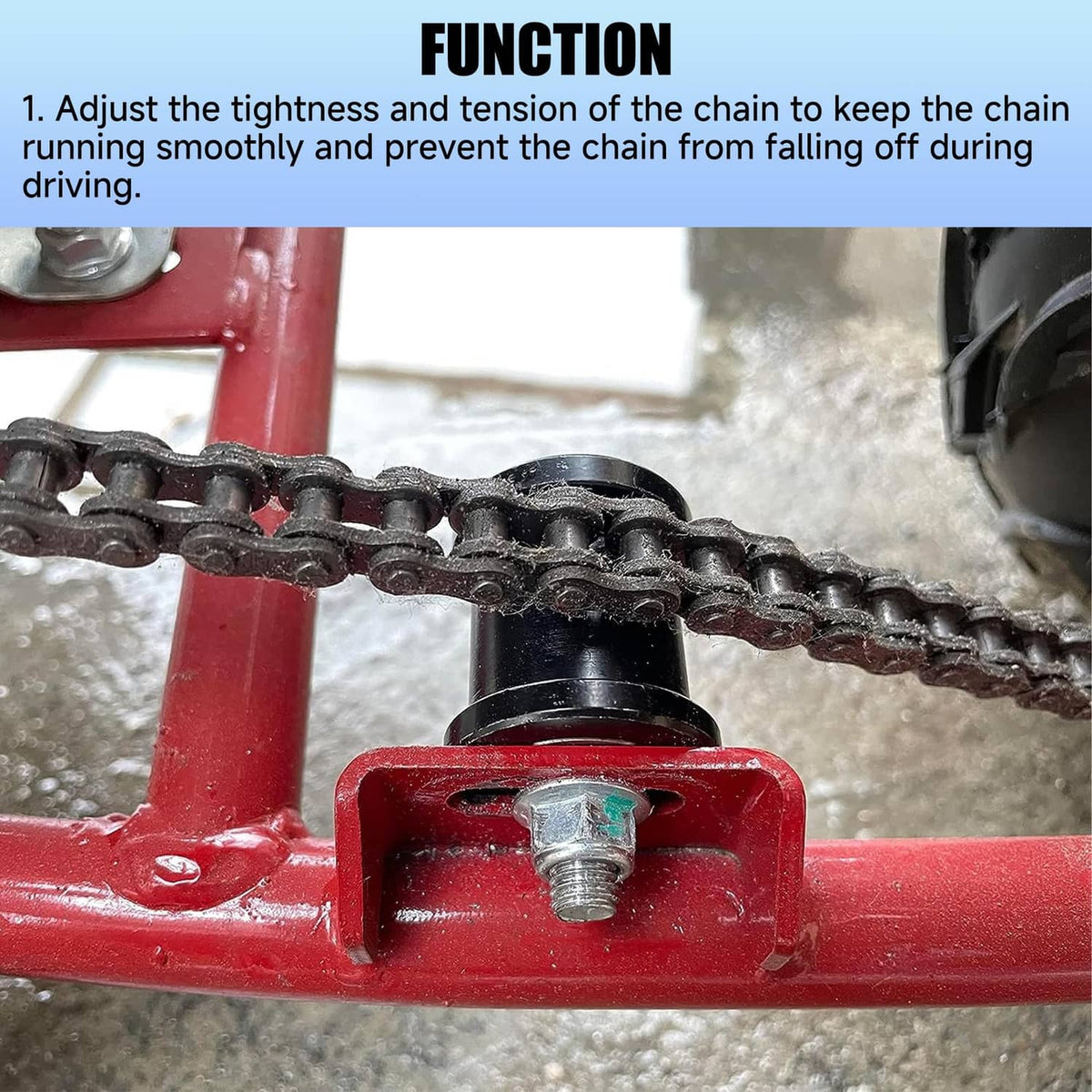 Chain tensioner roller against bike chain, black housing with silver axle bolt