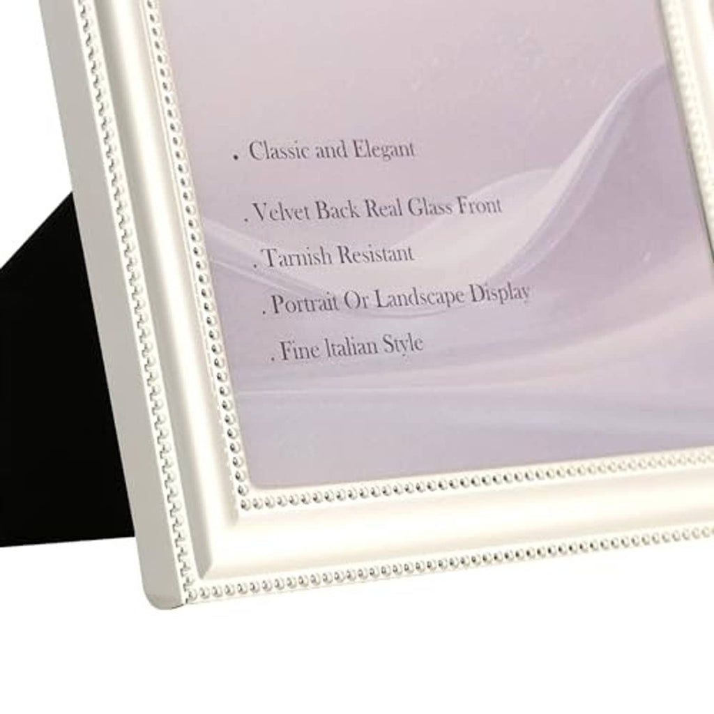 Silver picture frame corner detail with beaded trim and white mat edge