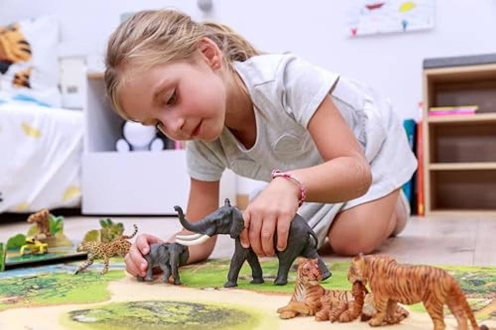 Woolly mammoth figure with ivory tusks, in a kids play scene