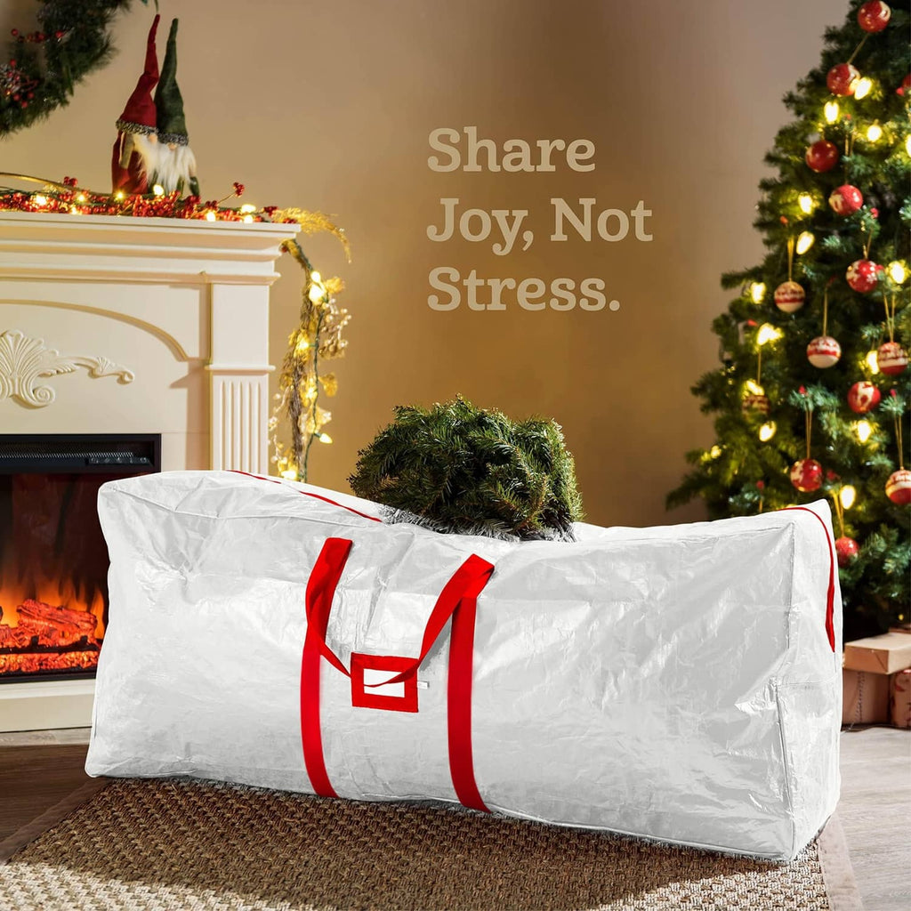 White large Christmas tree storage bag with red carry handles, long rectangular shape.