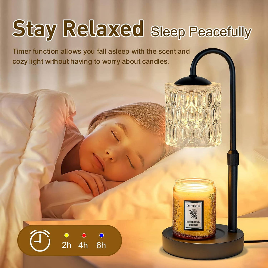 Dimmable candle warmer lamp with clear glass shade and glowing jar candle on stand