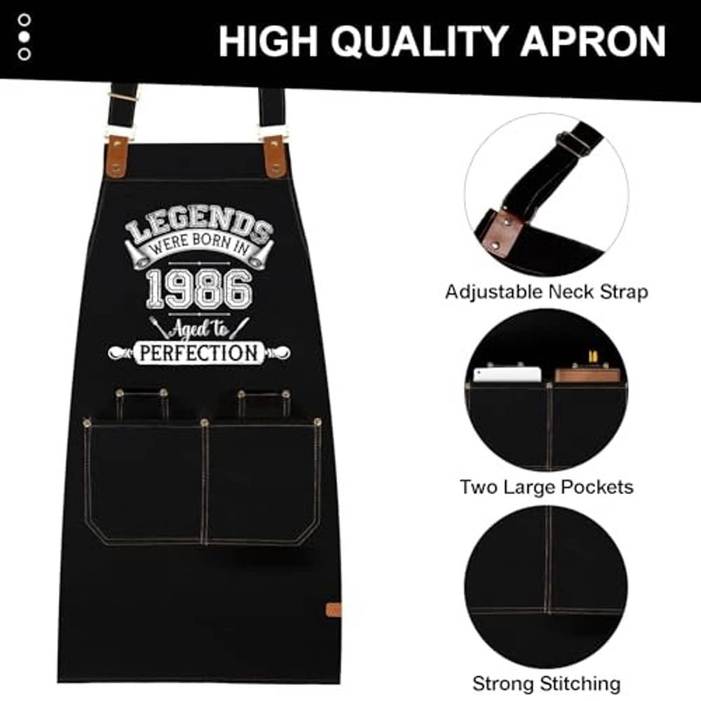 Black apron with adjustable neck strap and two large front pockets, visible stitching.