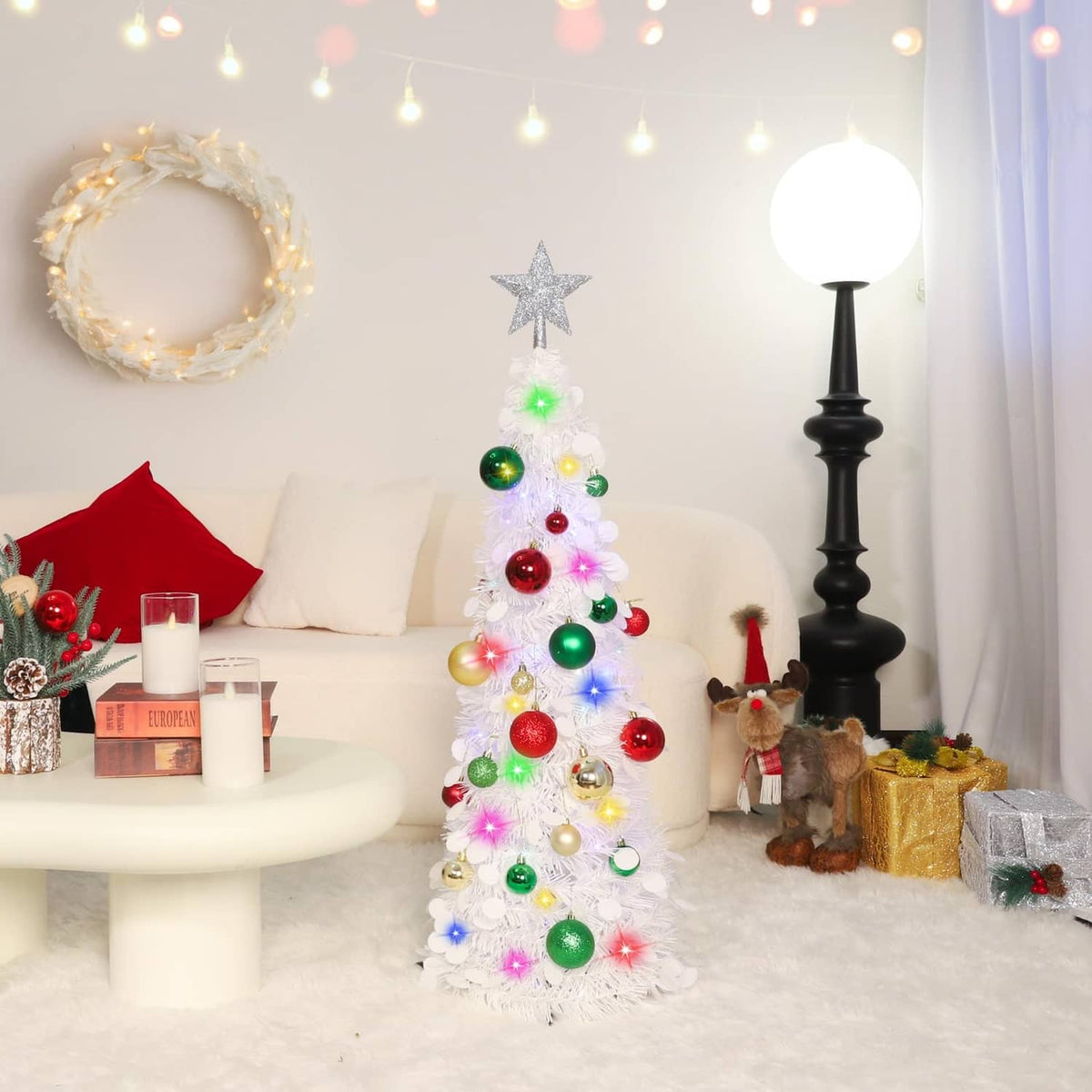 White pop-up Christmas tree with glowing multicolor lights, gold star topper, ornaments