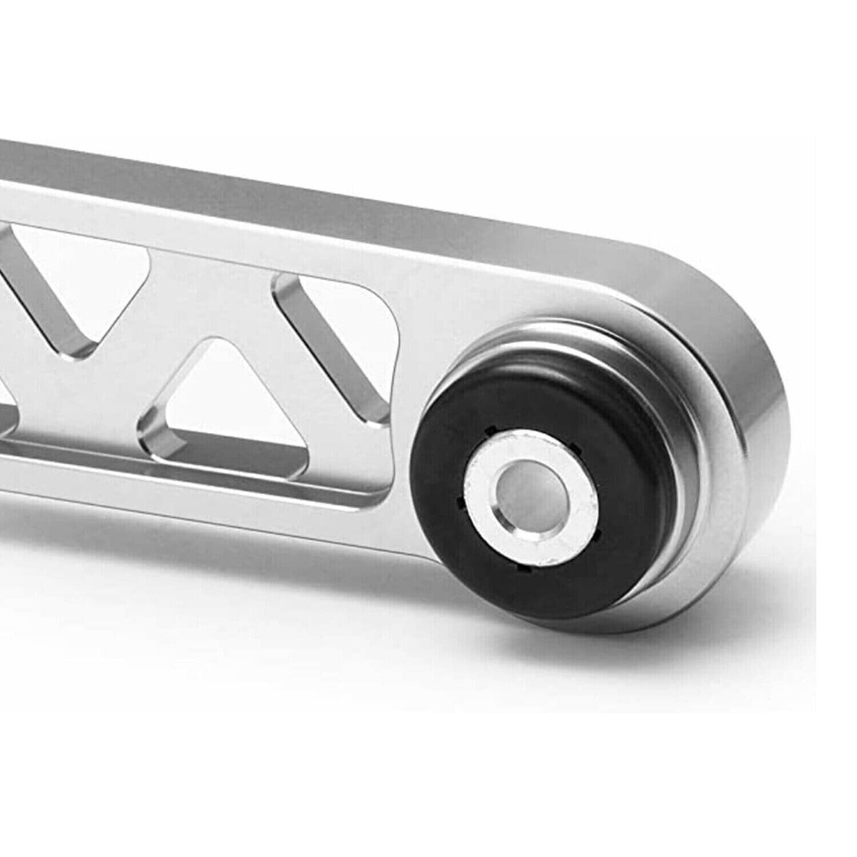 Close-up of silver control arm end with black rubber bushing
