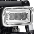 Chrome rectangular front LED headlight with three lens sections and clear cover glass