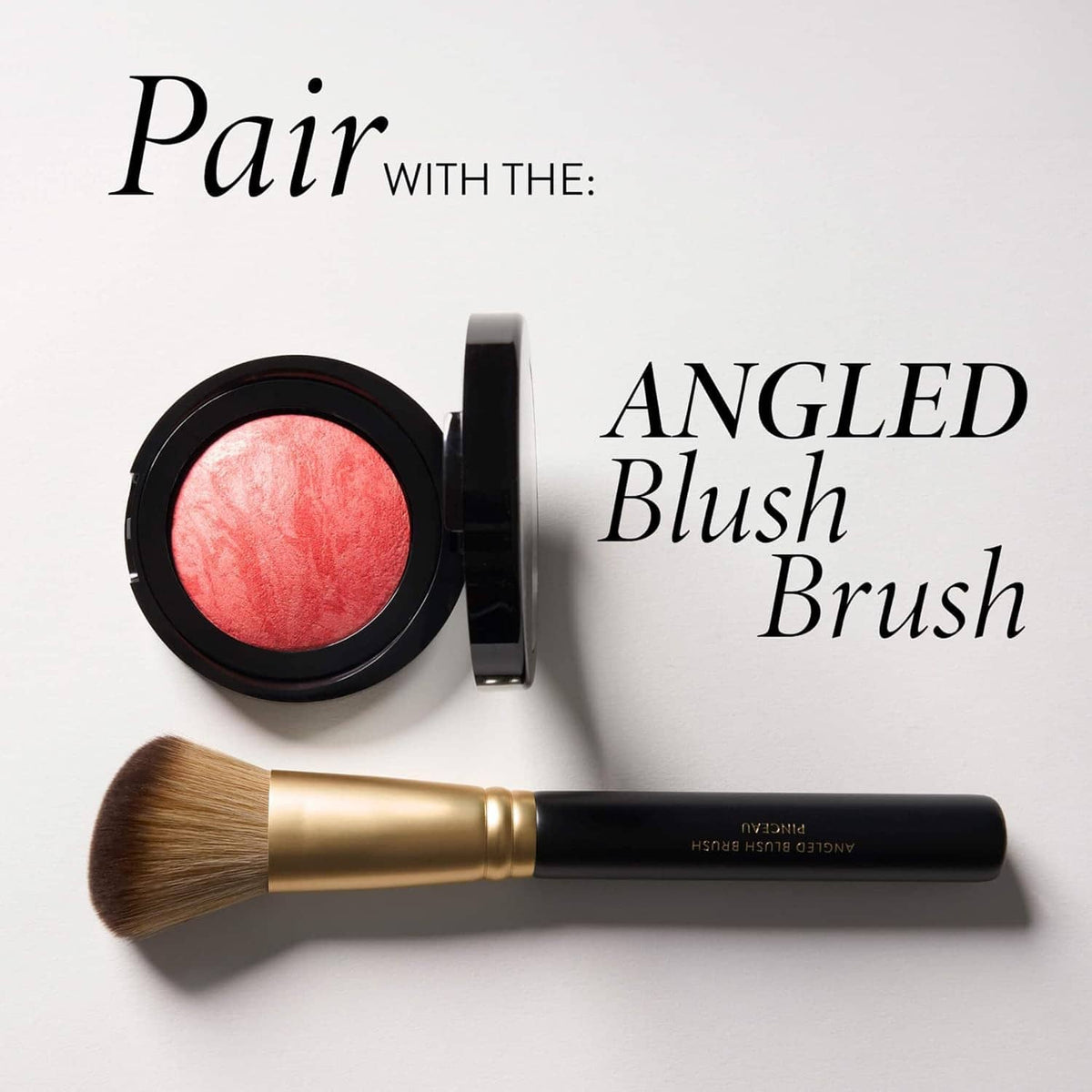 Angled blush brush with powder blush compact for applying cheek color
