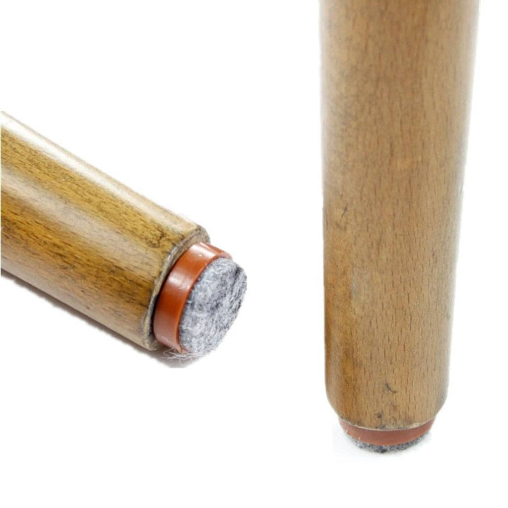 Felt nail-on glide pad attached to a wooden chair leg: brown base with gray felt