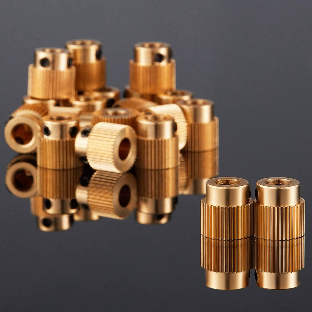 Assorted brass extruder drive gears, ribbed cylinders with black inserts and holes