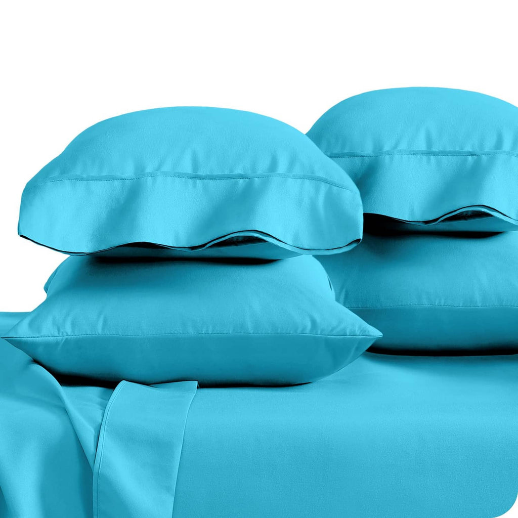 Two turquoise king pillowcases stacked, showing curved top seams and overlap