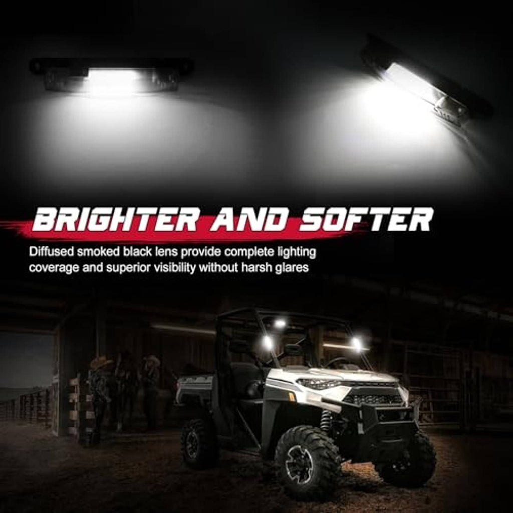 Smoked-lens LED light bar mounted on a roll cage, shining bright white light