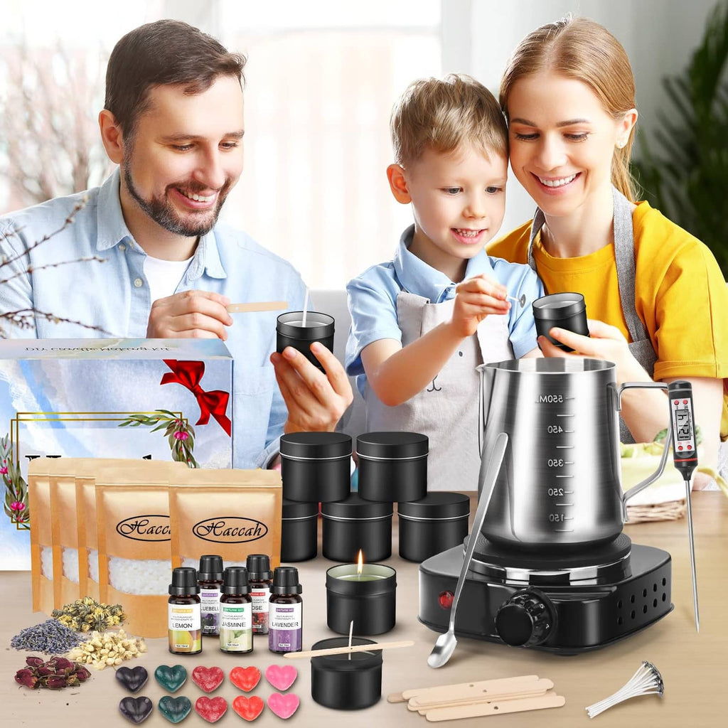 Candle making kit with wax melter, black candle jars, essential oil bottles and wicks