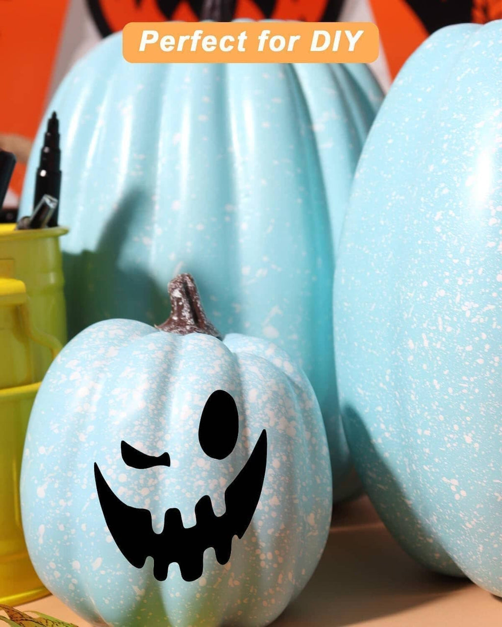 Light blue plastic jack-o'-lantern pumpkin with black face and curled stem