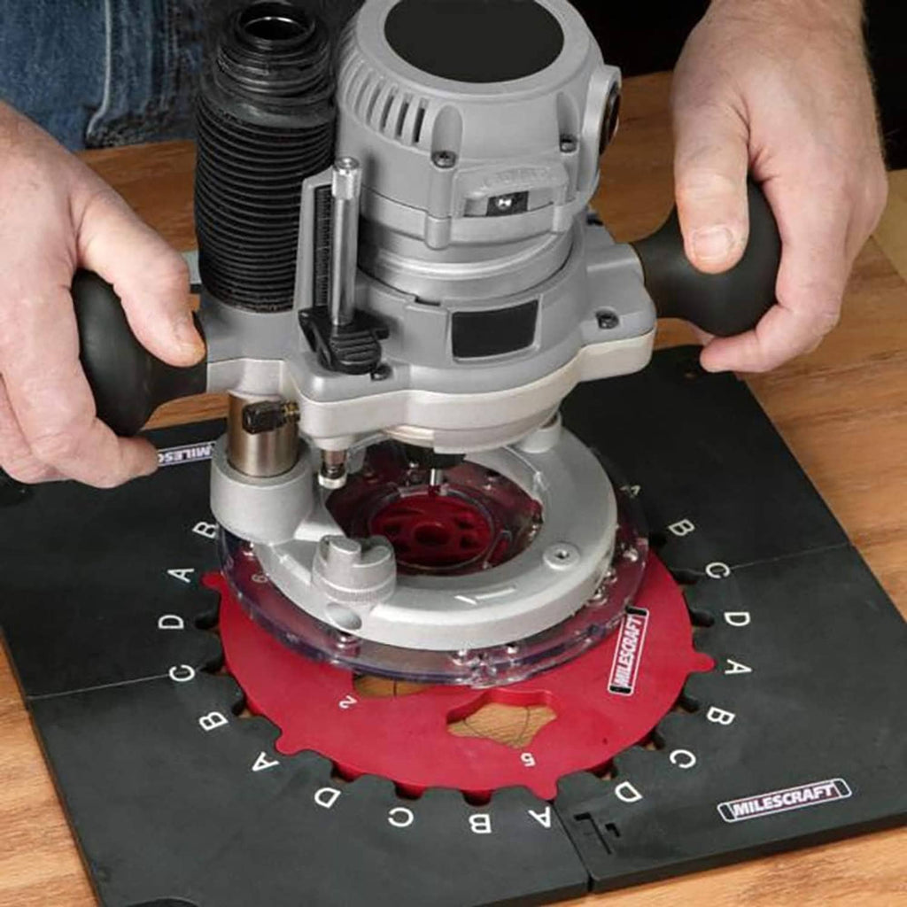 Router jig in use with red inlay template on black base plate under a router