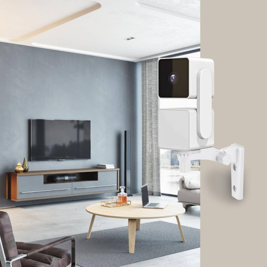 White camera wall mount installed on wall near a living room TV stand
