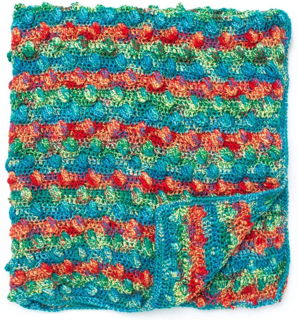Multicolor textured yarn swatch with chunky looped knit stitches