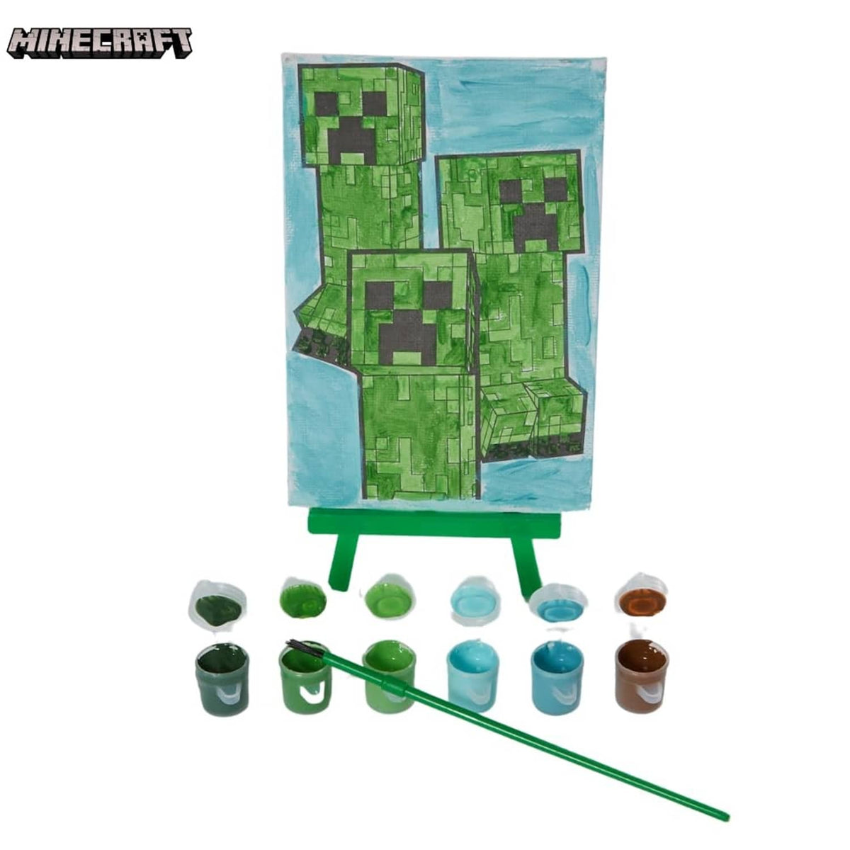 Painted Minecraft canvas on green easel with paint pots and green-handled paintbrush