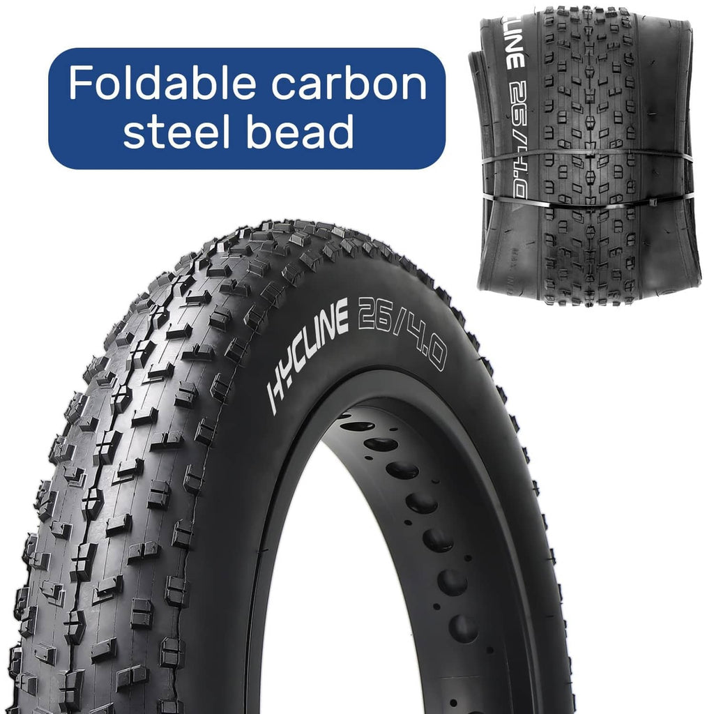 Black fat bike tire with visible tread blocks and folded bead area