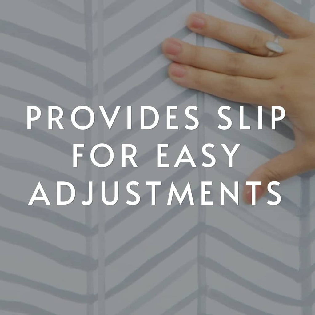 Peel and stick wallpaper with geometric pattern and hands smoothing it