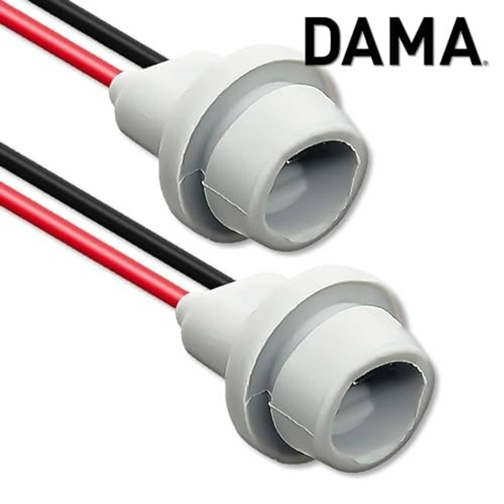 DAMA rubber-base bulb socket with gray housing and red/black wire leads, close-up