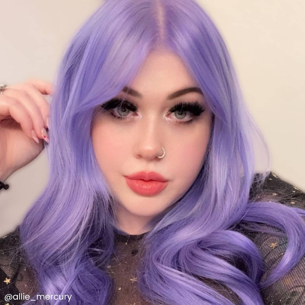 Semi-permanent hair color on long wavy lavender-purple hair