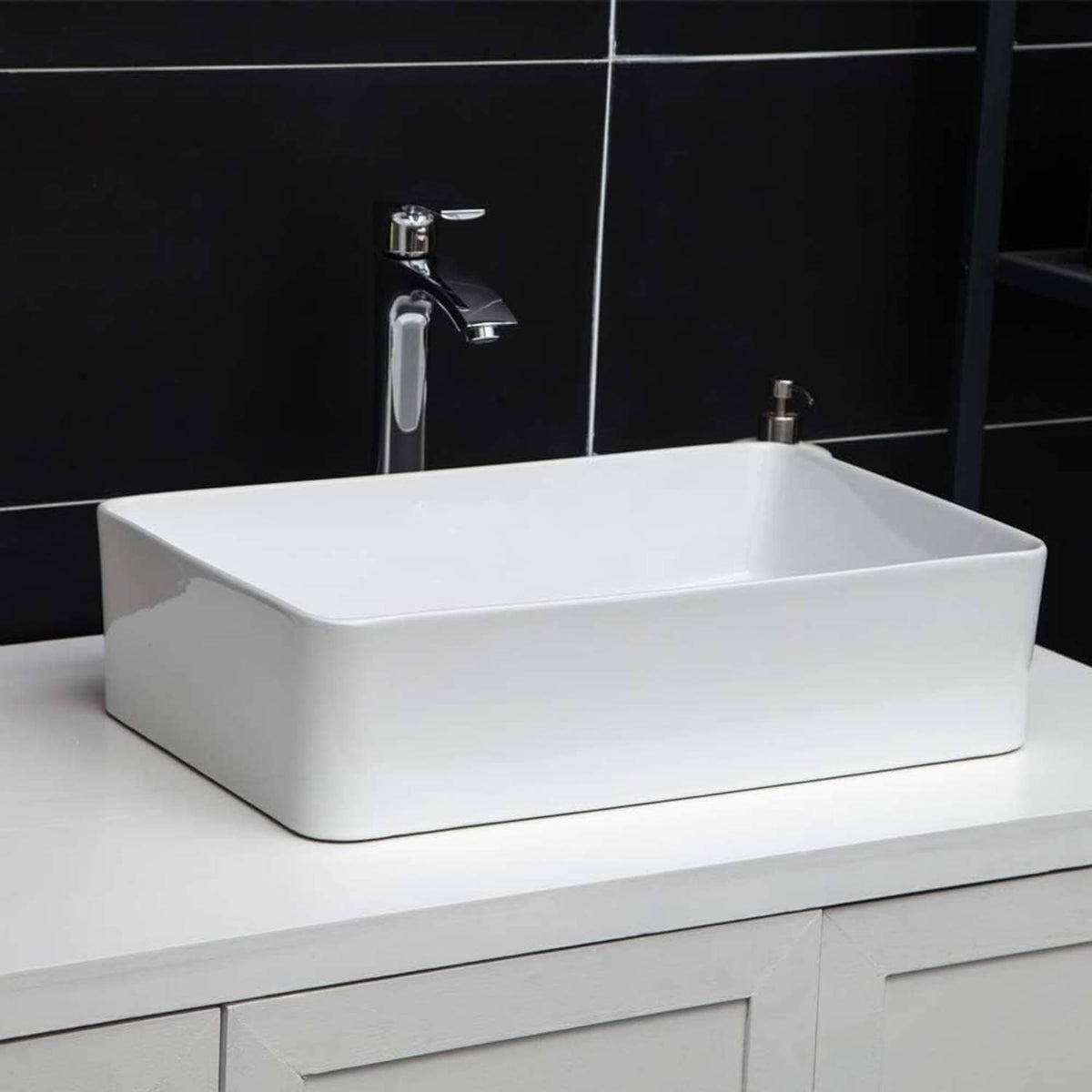 White rectangular bathroom vessel sink with tall chrome faucet and front drain opening