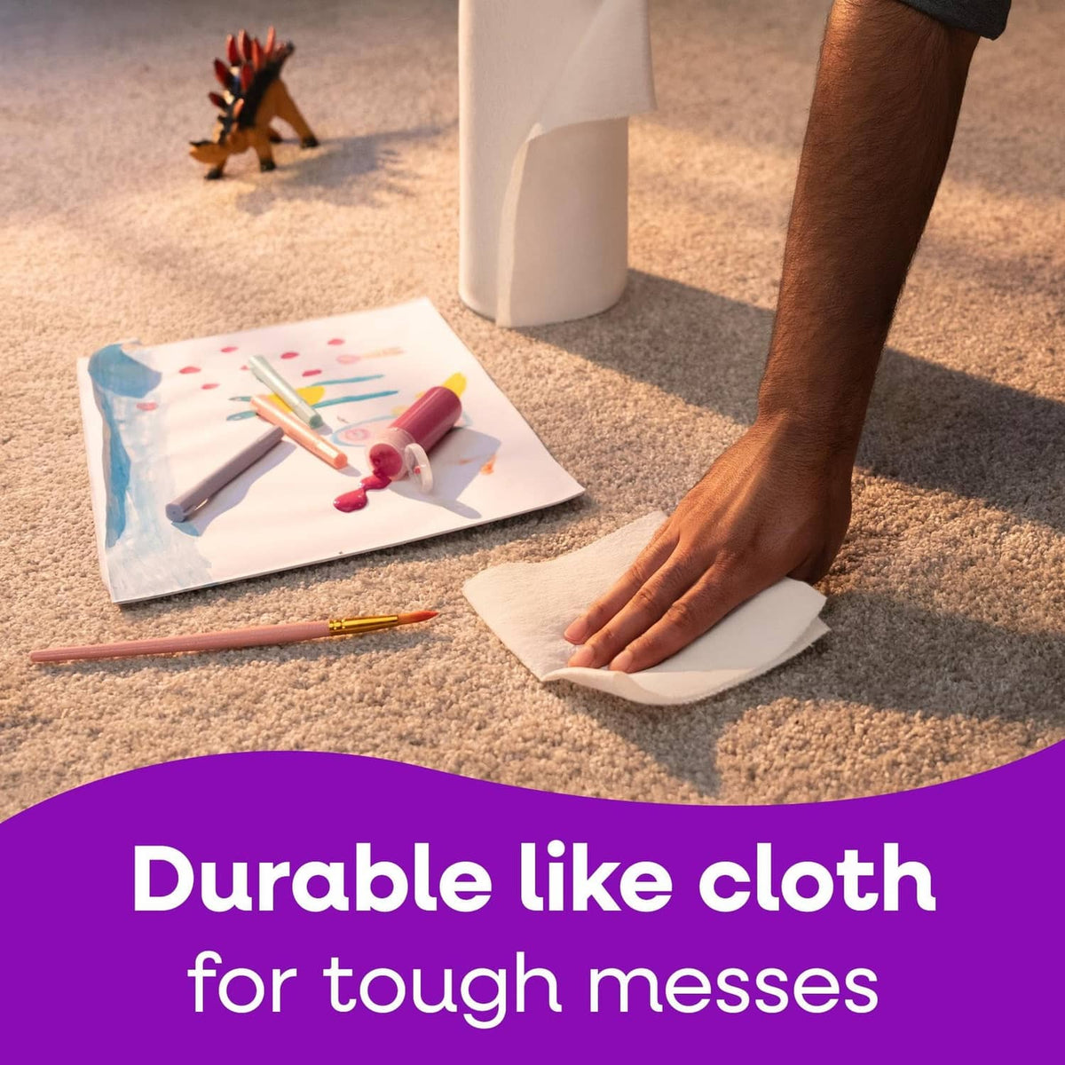 Paper towels roll being used on the floor with sheet pulled out for cleanup