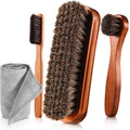 Brown horsehair shoe brush set with wooden handles and small polishing dauber applicators