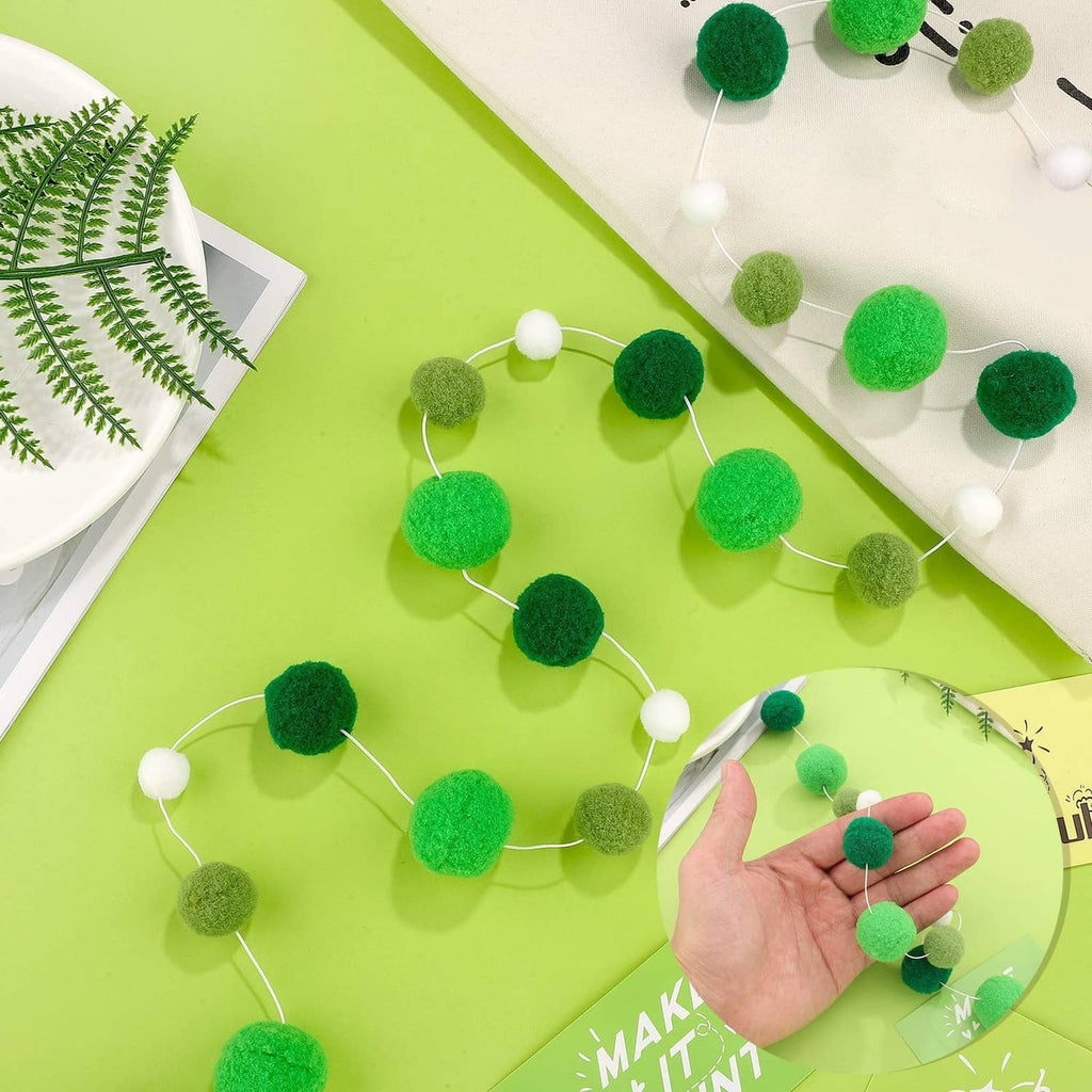 Green felt ball garland with white bead connectors, rounded fuzzy ball design
