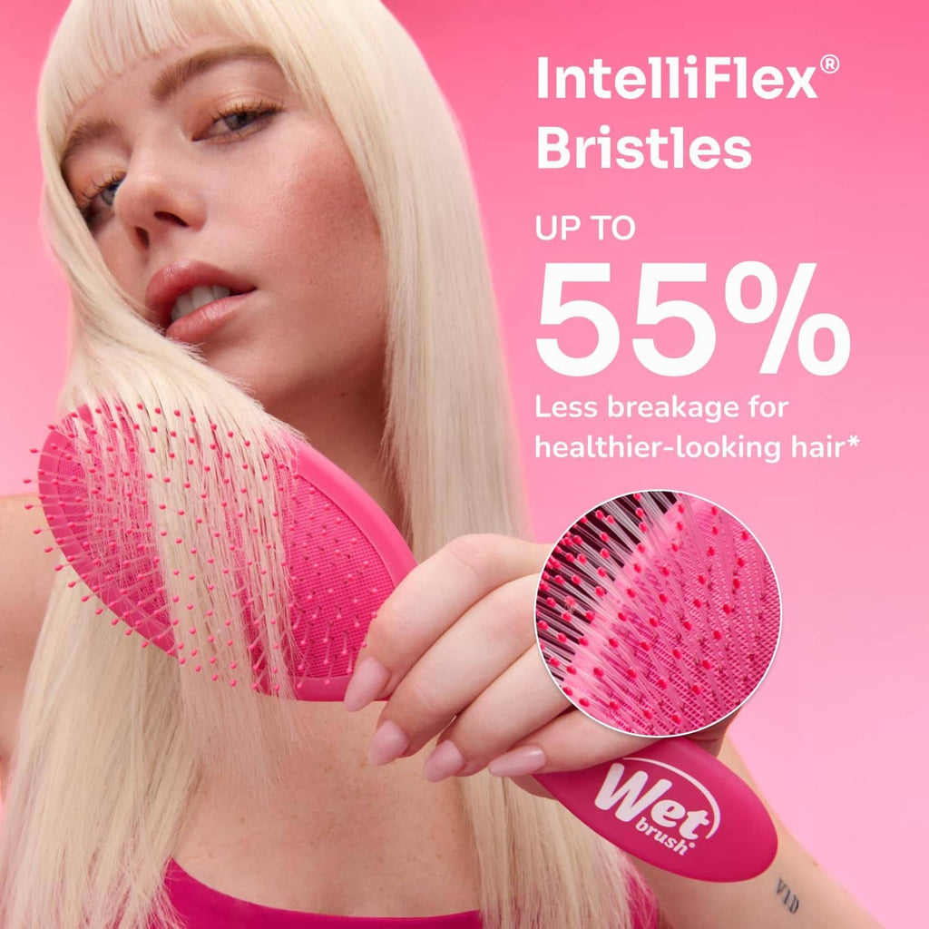 Mini detangling hair brush with pink grip and IntelliFlex bristles