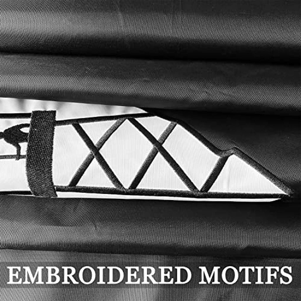 Close-up of embroidered flag motifs on black and white fabric panels