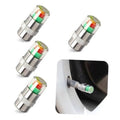Set of four silver car tire valve stem caps with green red color indicator rings