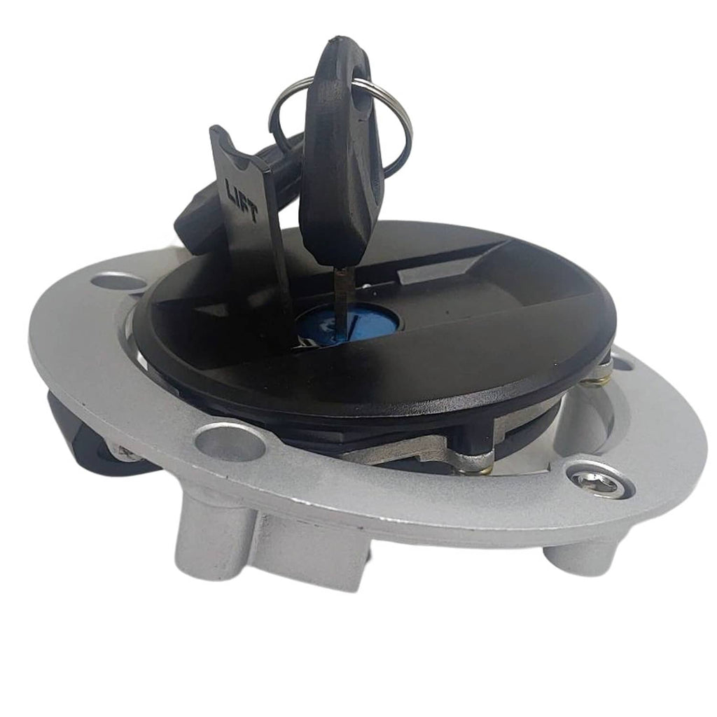 Fuel tank cap cover with black hinged insert and key slot, viewed from above