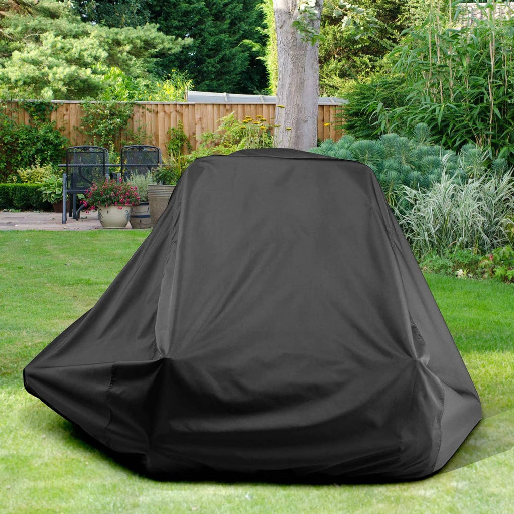 Black zero-turn mower cover on outdoor lawn, fully covering mower body