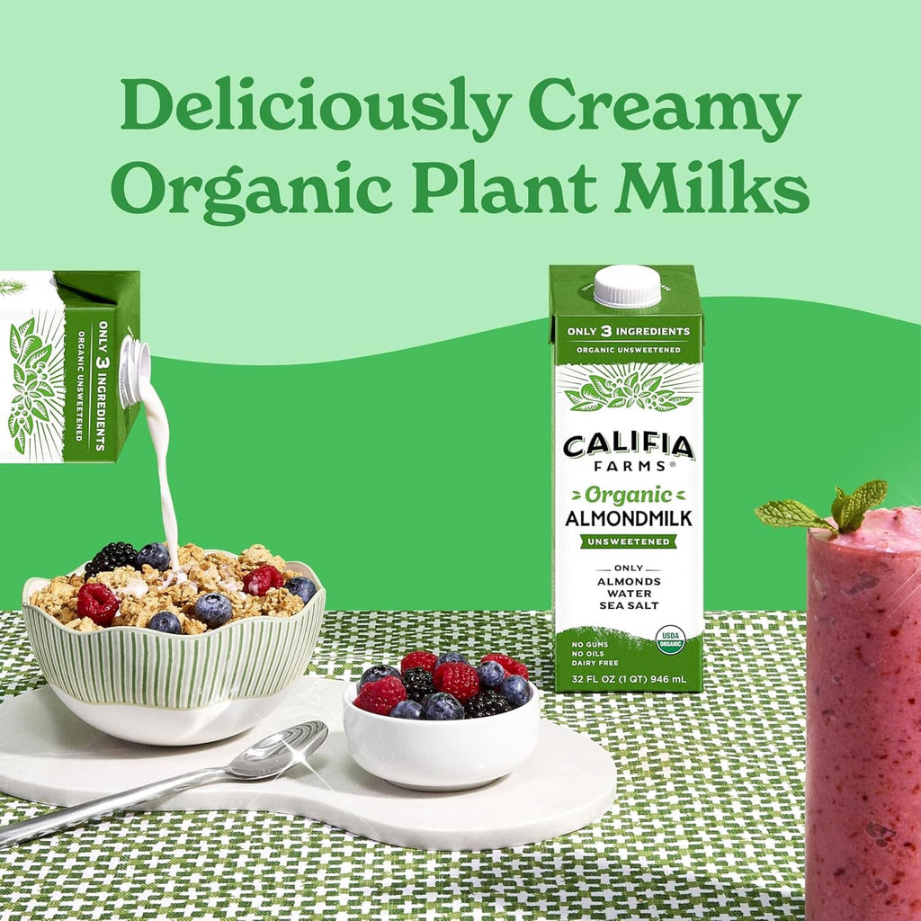 Organic unsweetened almond milk carton with berry smoothie bowl