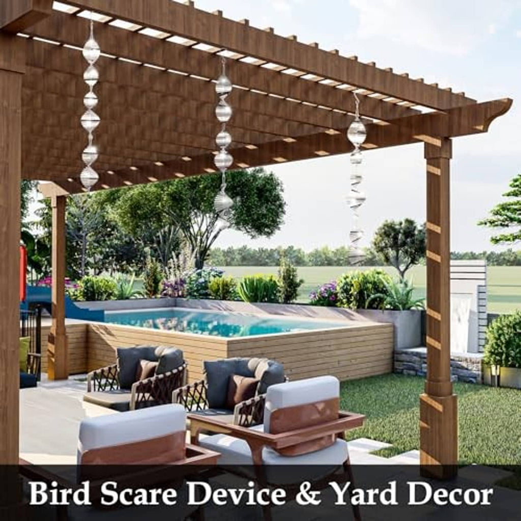 Silver stacked-disc wind spinners suspended under a wooden patio pergola