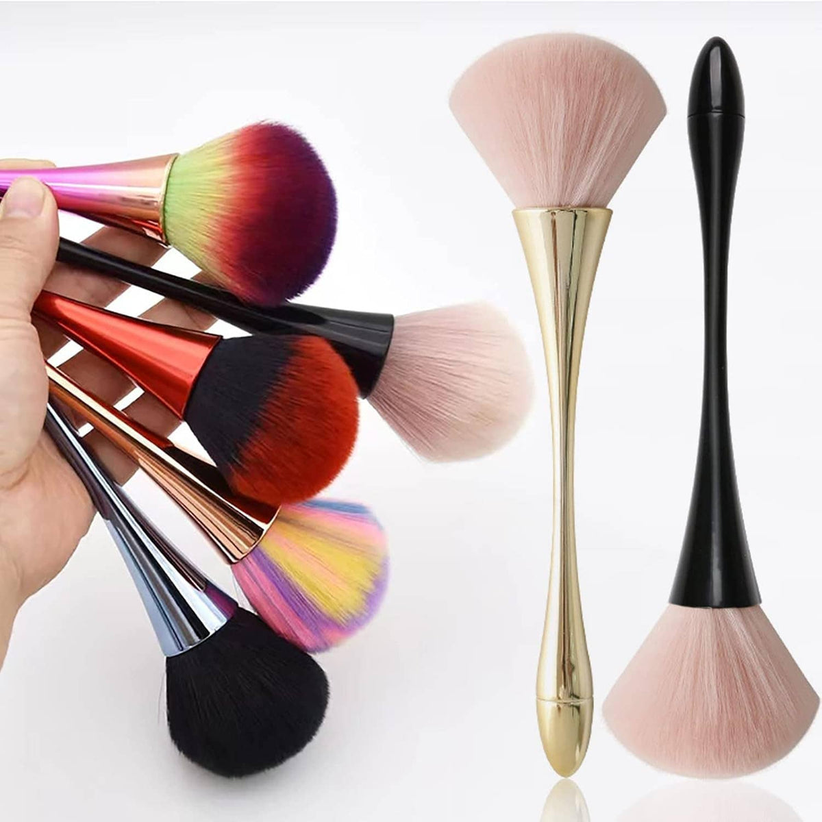 Large nail dust brushes with pink bristles, gold and black handles, held in hand