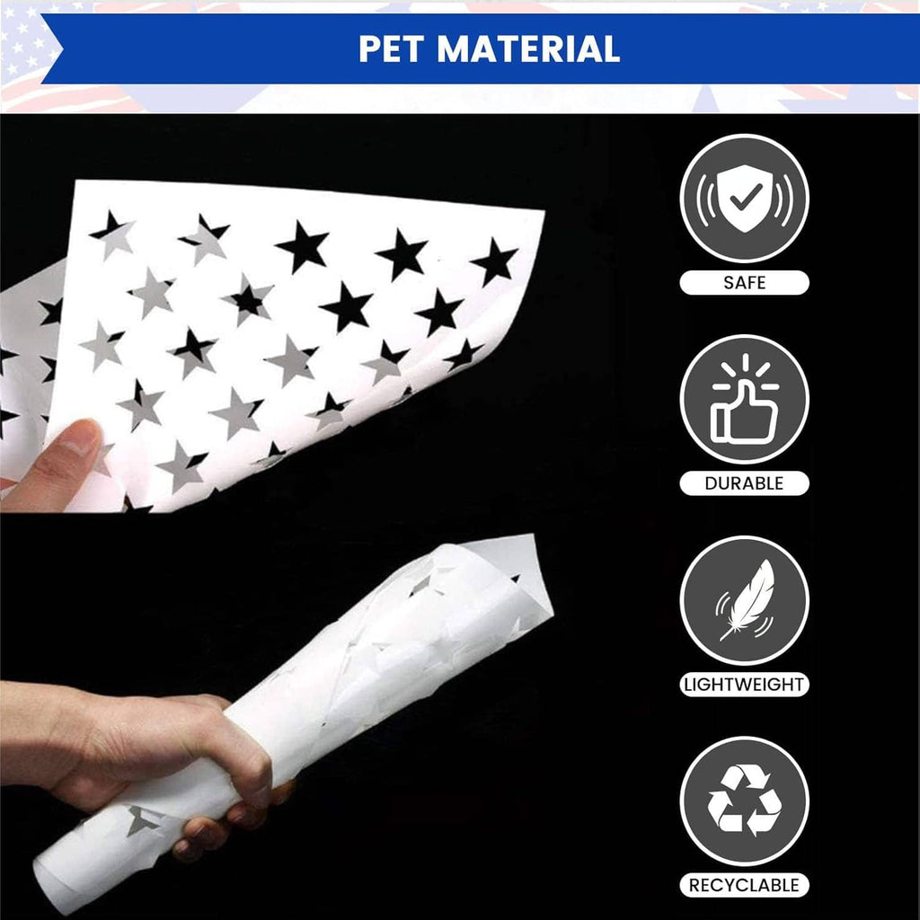 Rolled star stencil sheet with black cutout stars, shown in hand