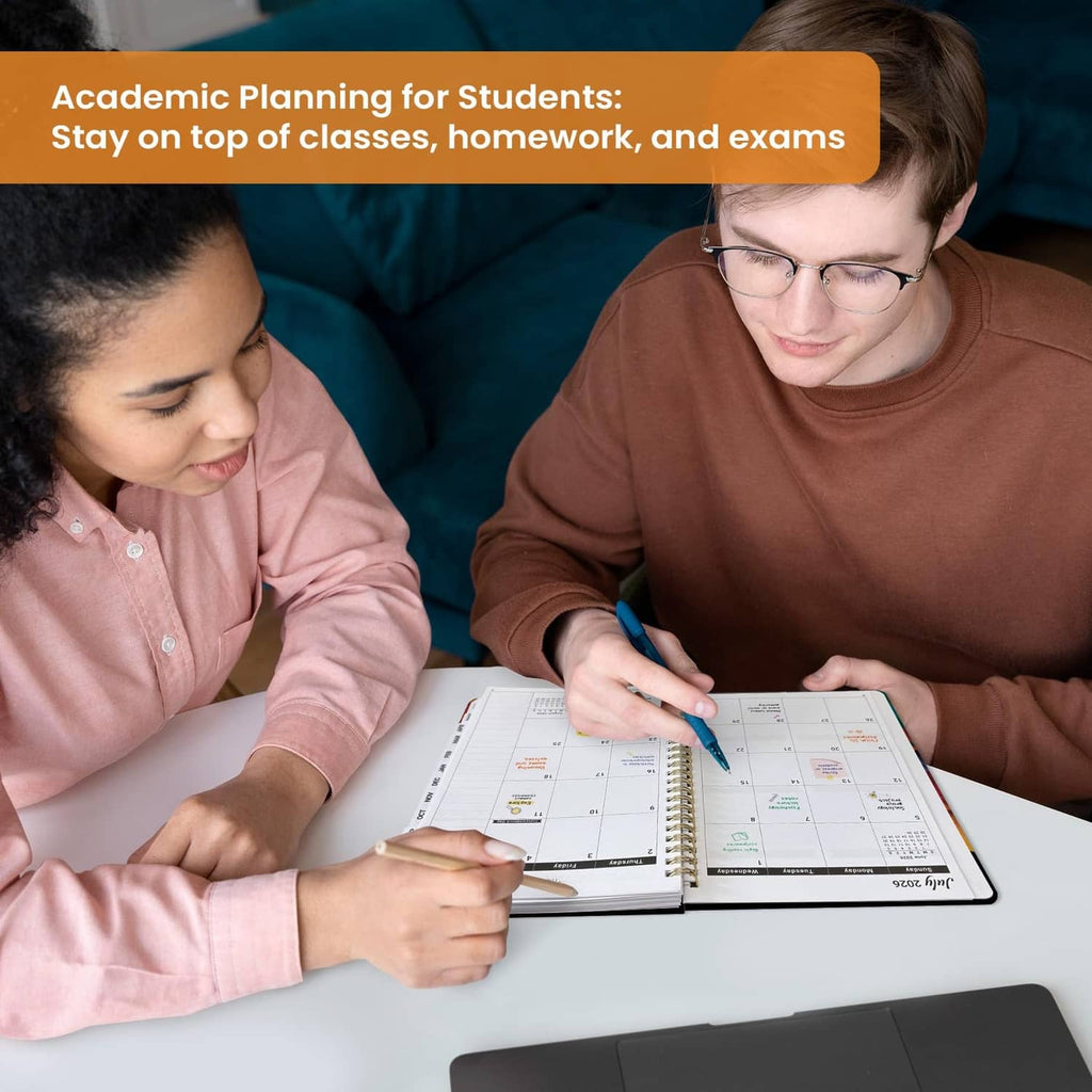 Academic planner open to a calendar page, with handwritten notes on desk