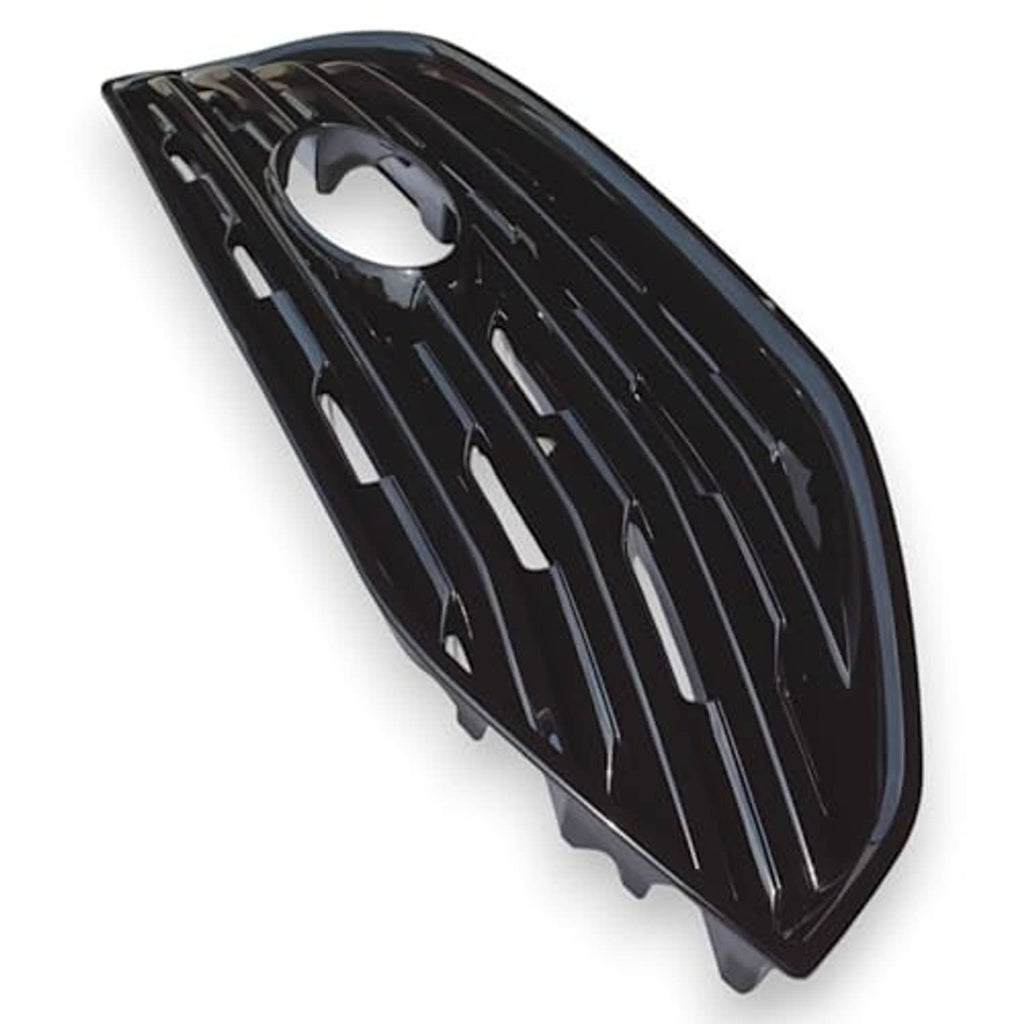 Gloss black front grille overlay angled view with slatted openings and round center opening