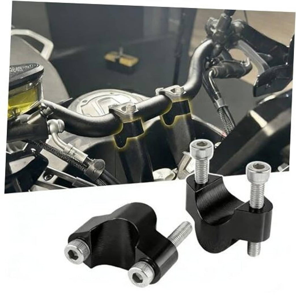 Black handlebar riser mount clamps with silver bolts for motorcycle handlebar height