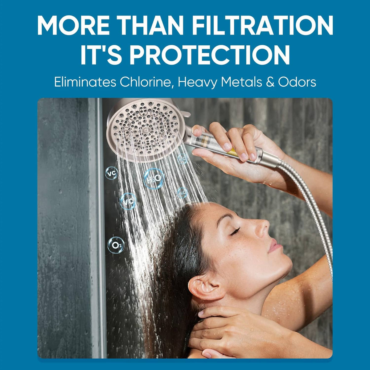 Brushed nickel handheld shower head spraying water from a flexible hose connection