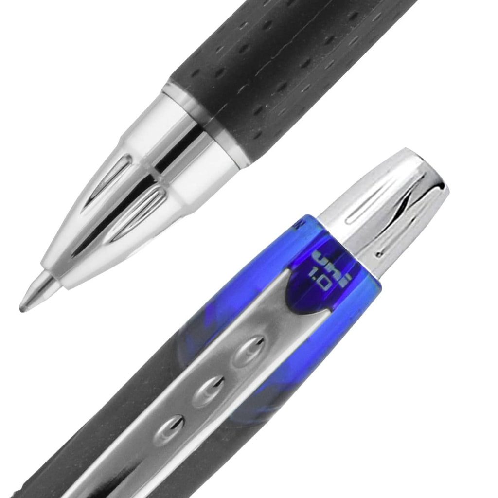 Close-up of blue ink ballpoint pen with silver retractable tip