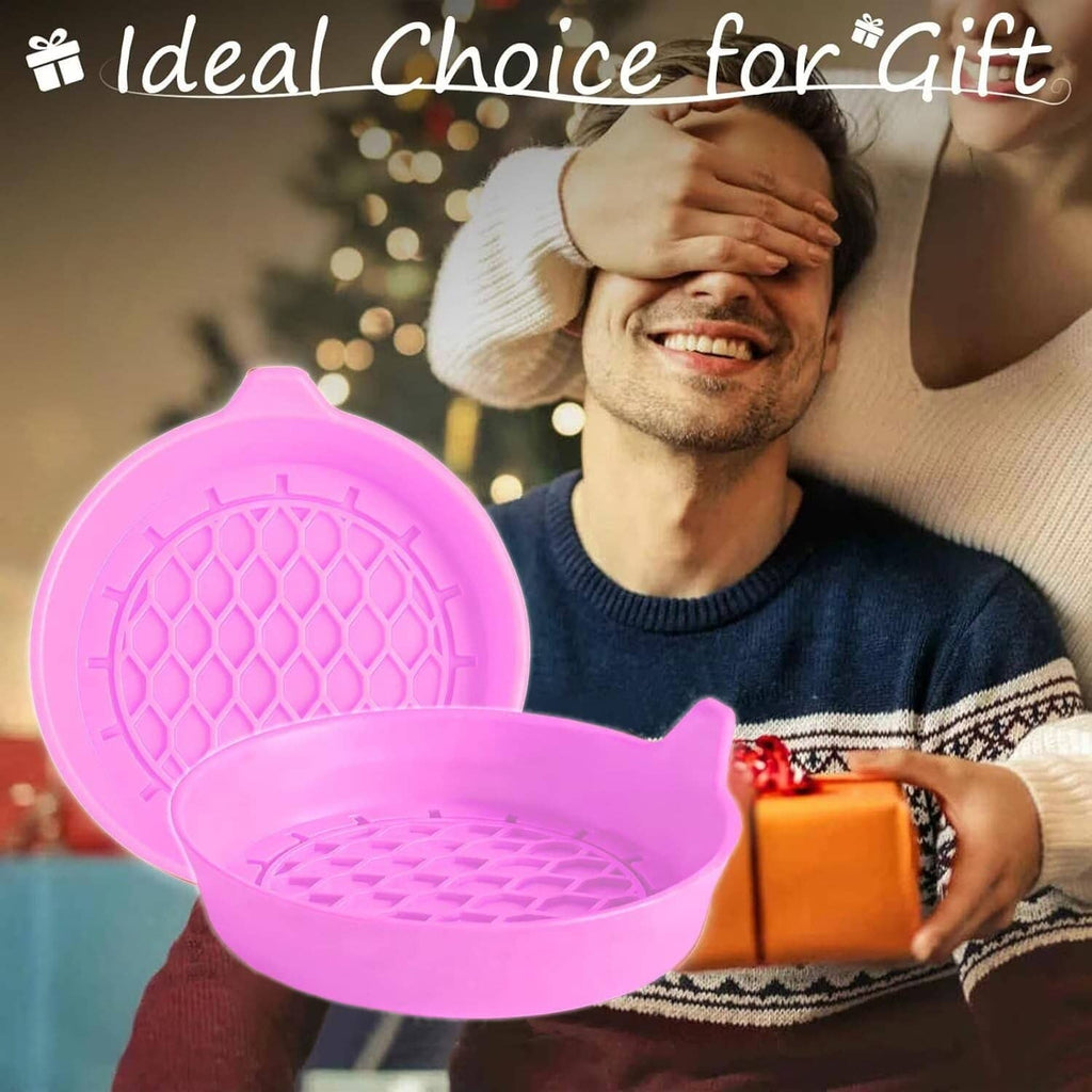 Pink silicone car cup coasters in hand, round embossed anti-slip surface