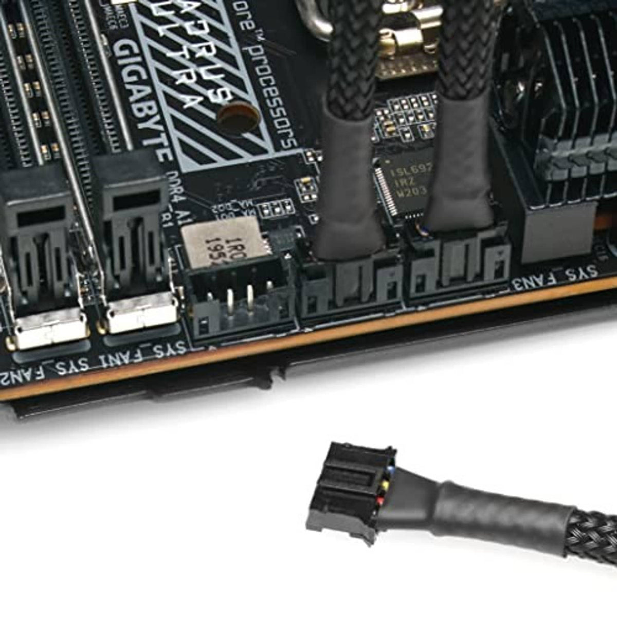 Braided micro 4-pin fan adapter cable connector on PCB edge, close-up