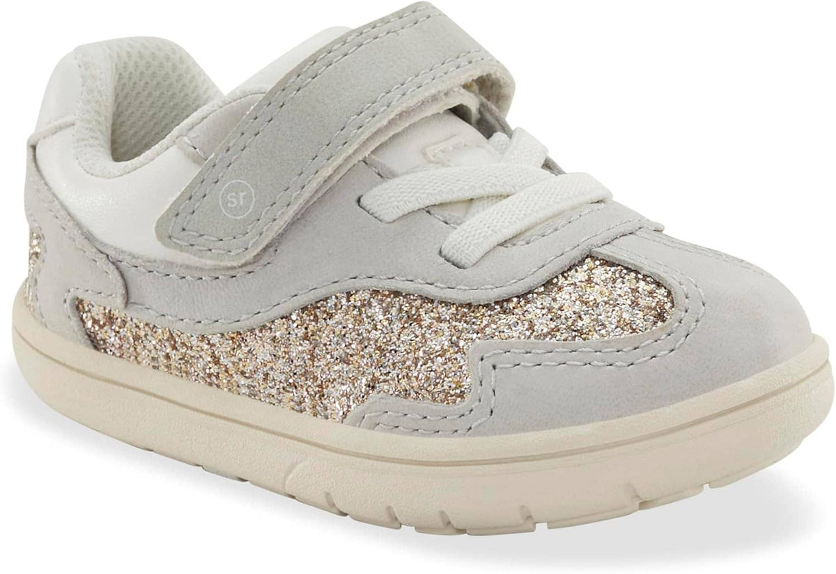 Kids' sneakers with gray glitter toe panel, Velcro strap, and white rubber sole
