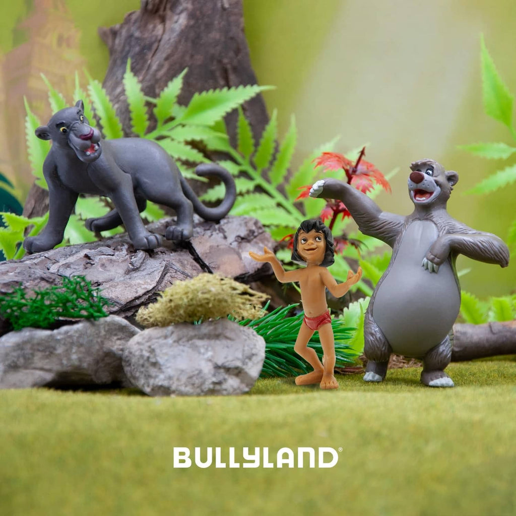 Painted bear toy figure in a play scene, grey fur and white belly, arms lifted